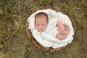 outdoor newborn baby in basket