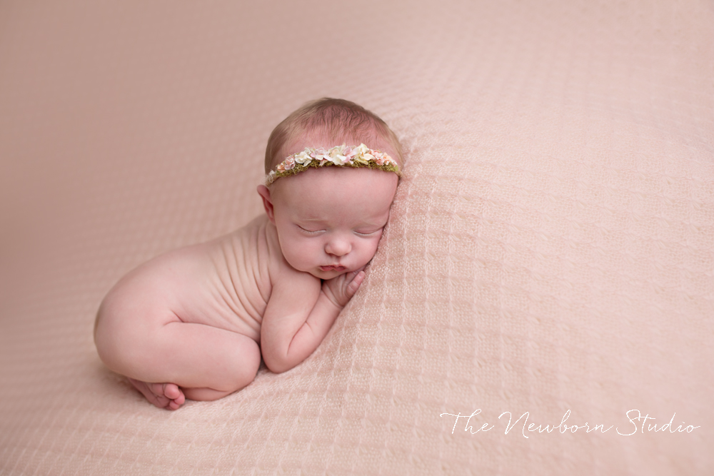 newborn baby girl pink beanbag studio