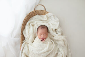 newborn baby in bassinet