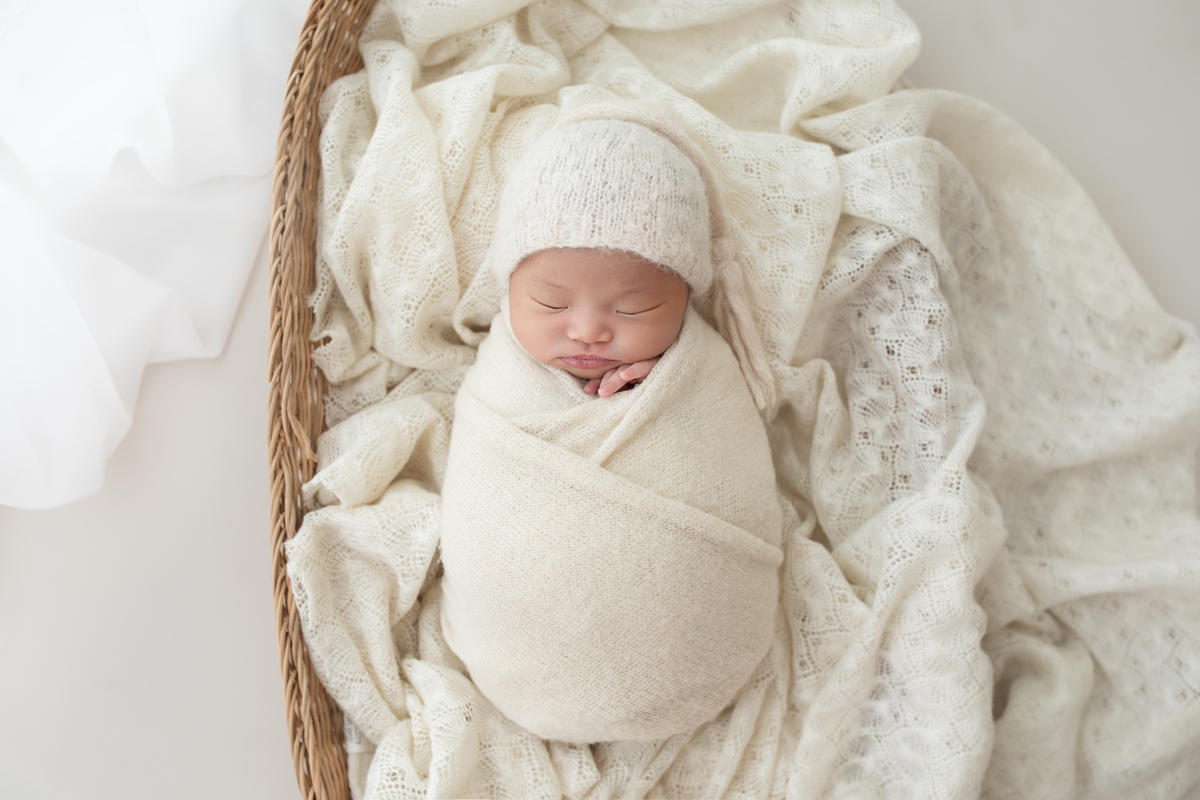 newborn wrapped in studio