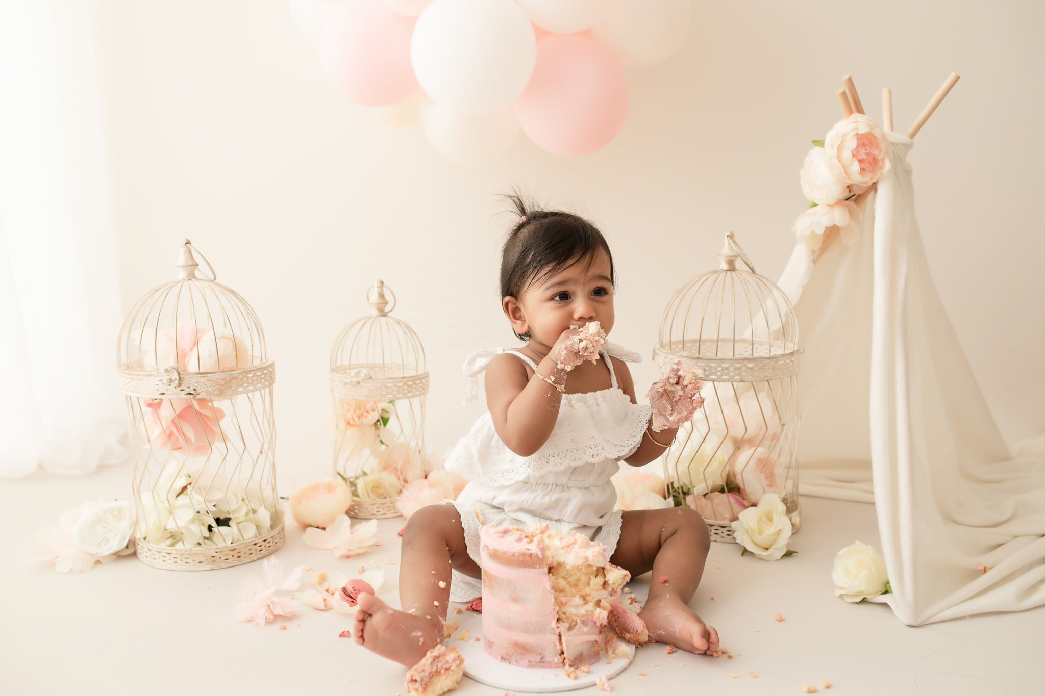 baby girl cake smash in studio, pink white floral