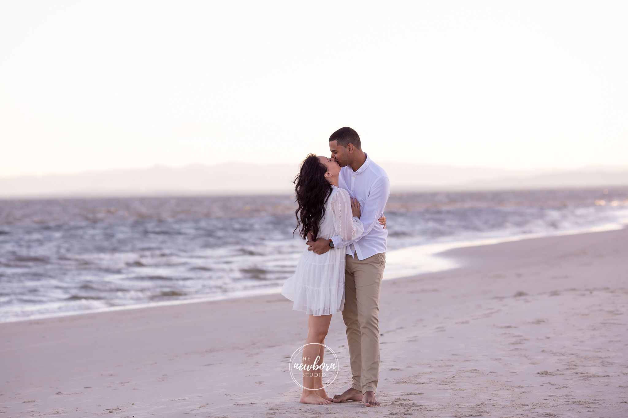 couple on the beach kissing