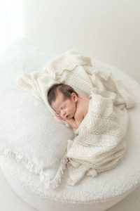 newborn baby girl in photo studio