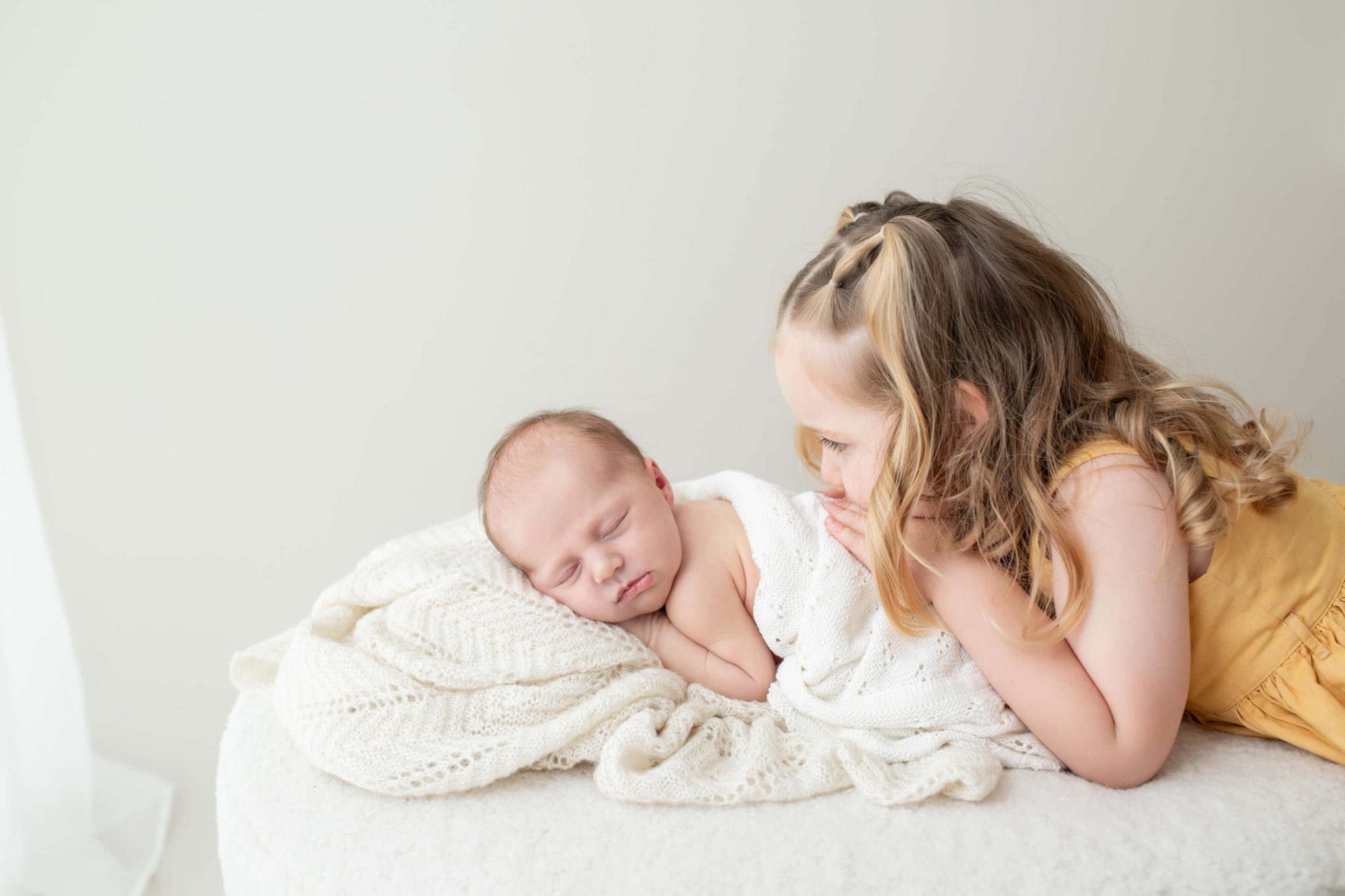 newborn baby and big sister