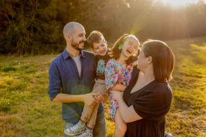 family laughing in the sunset brisbane