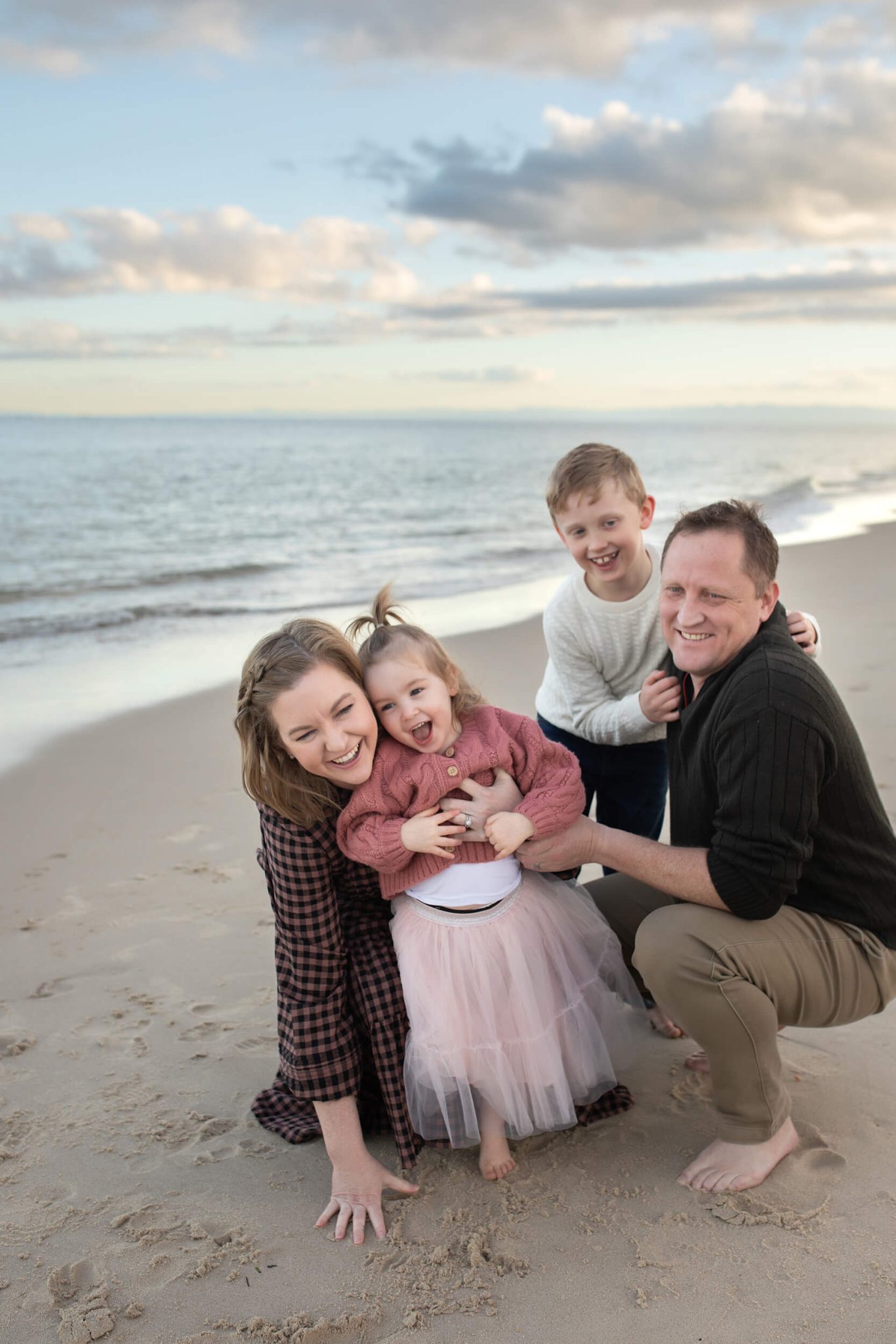 family together at the beach mini session